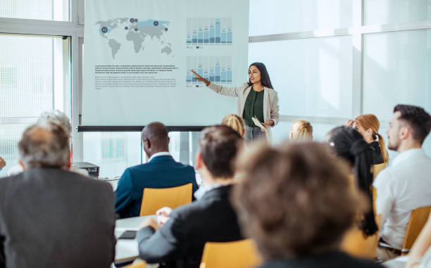 istock Diverse Professionals Engaging in Business Conference Discussion 2190510321