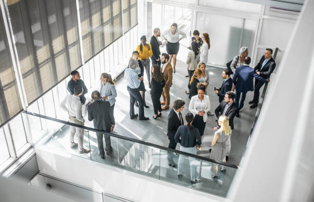 istock Diverse Professionals Engaged in Lively Networking at Conference 2190510417