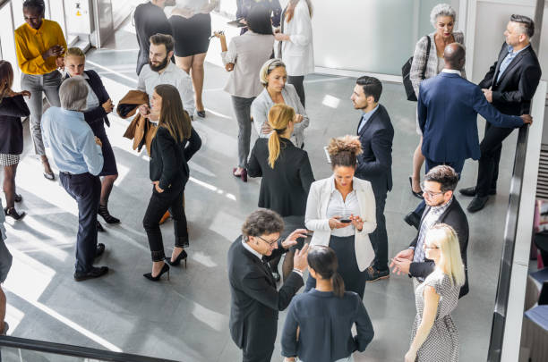 Diverse Professionals Engaged in Lively Business Networking
