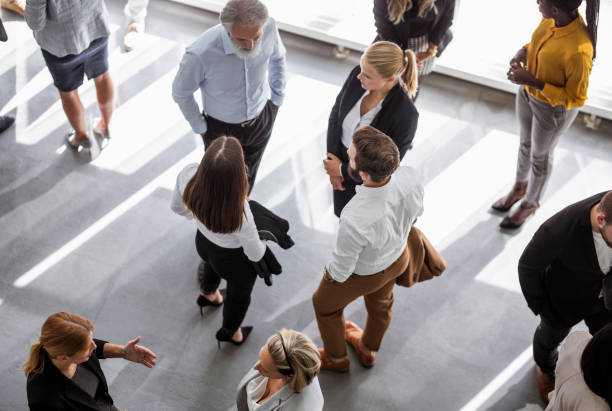 istock Diverse Professionals Engaging Energetically at Business Conference 2190510444
