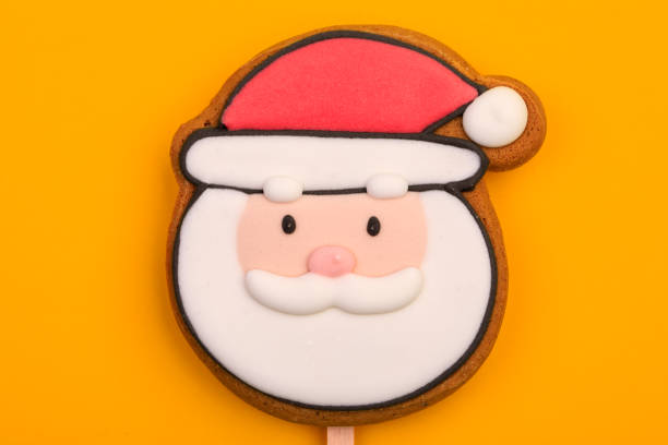 istock Santa Claus gingerbread cookie on yellow background 2190511699