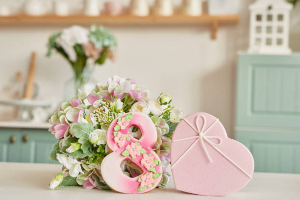 istock Gingerbreads for March 8 in the bright kitchen with flowers 2190511790