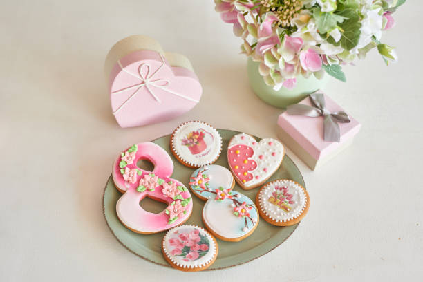 istock Gingerbreads for March 8 in the bright kitchen with flowers 2190512421