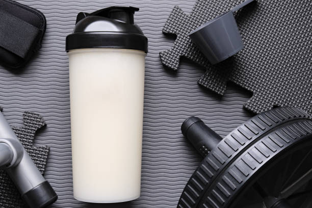 istock Protein drink and equipments on a grey mat background. 2190513843