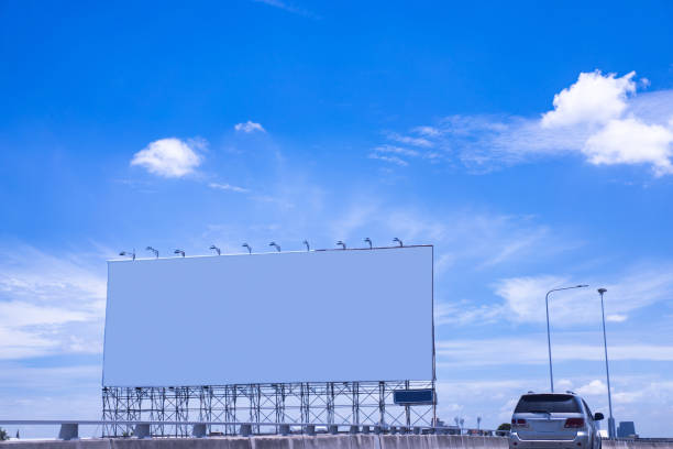 istock Large blank white billboard in the morning sky background. 2190514216