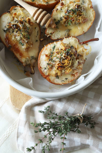 istock baked half pears with gorgonzola cheese. 2190515550