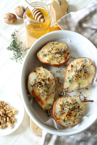 istock baked half pears with gorgonzola cheese. 2190515631