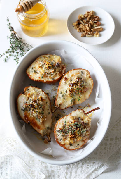 istock baked half pears with gorgonzola cheese. 2190515634