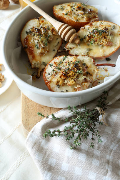 istock baked half pears with gorgonzola cheese. 2190515635