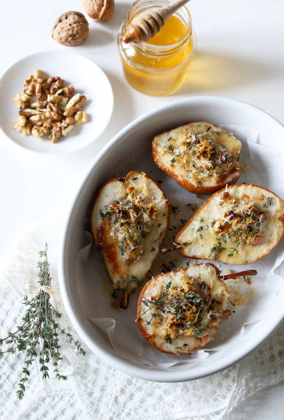 istock baked half pears with gorgonzola cheese. 2190515665