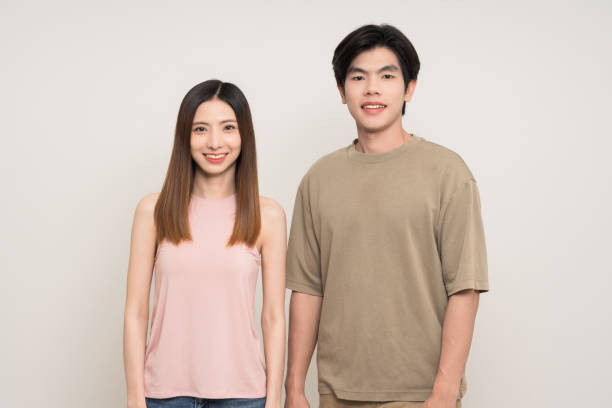 istock Happy asian couple attractive in various action gesture standing on isolated white background. Cheerful Smiling young man and woman 2190516331