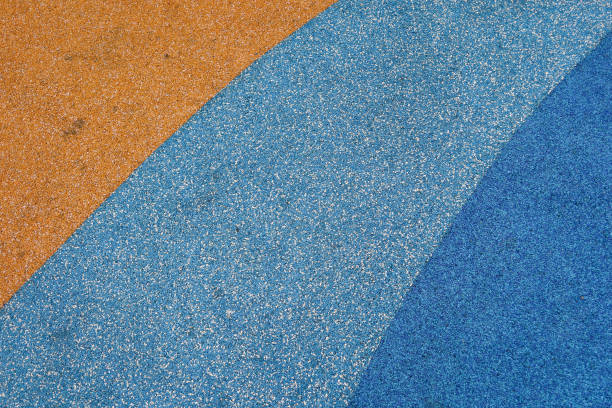 istock yellow, blue and light blue rubber mat flooring in children playground 2190520742