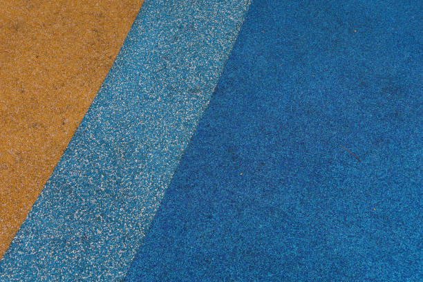 istock yellow, blue and light blue rubber mat flooring in children playground 2190520743