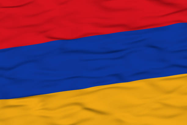 The flag of Armenia is waving in the wind, featuring three horizontal stripes in red, blue, and orange. The motion emphasizes the flag's vibrant colors and fabric texture.