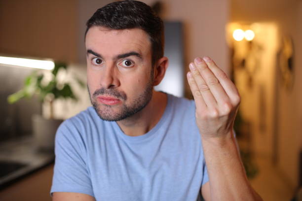 istock Man doing hand gesture to show disbelief 2190521656