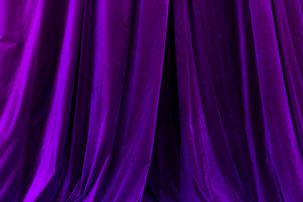 istock Violet curtain in theatre background 2190521791