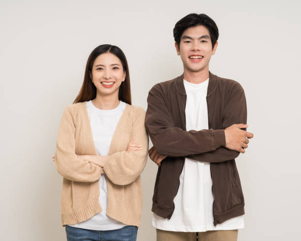 istock Happy asian couple attractive in various action gesture standing on isolated white background. Cheerful Smiling young man and woman 2190521846