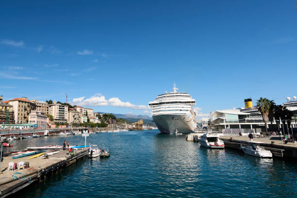 Savona, Italia - December 18, 2024: Savona's waterfront with a large cruise ship, modern office buildings, and a busy dock with small vessels. A lively urban maritime scene, ideal for tourism.