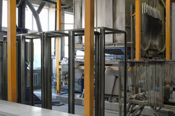 istock Large metal racks and tools in industrial workspace. Industrial furnace dominates a workshop. The high temperatures and the sound of machinery. Concept of intense activity and hard work 2190523067