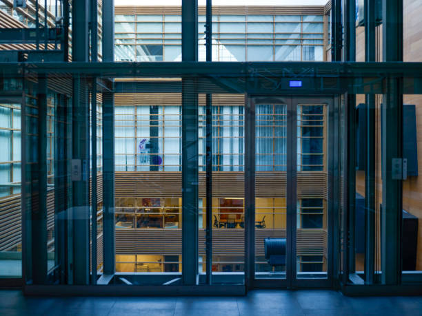 istock Corridor in office building with big windows passing daylight 2190523168