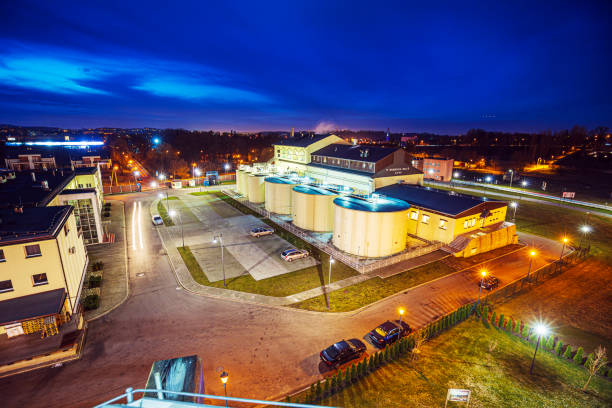A row of steel grain tanks