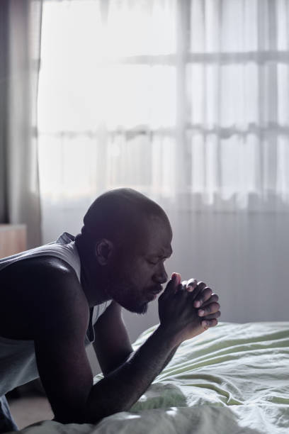 istock African American Man Praying Before Go to Bed 2190529054