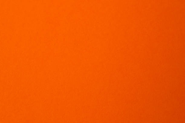 istock Vibrant orange background radiating warmth and energy in creative space 2190532029