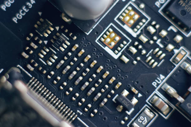 istock ICs and capacitors chip on motherboard 2190533015