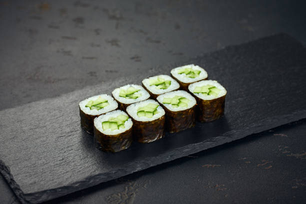istock Roll with cucumber on dark background. Sushi menu. Japanese food. 2190533108
