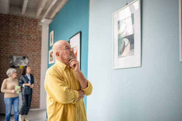 istock Art enthusiasts exploring an exhibit in a contemporary gallery setting 2190533376