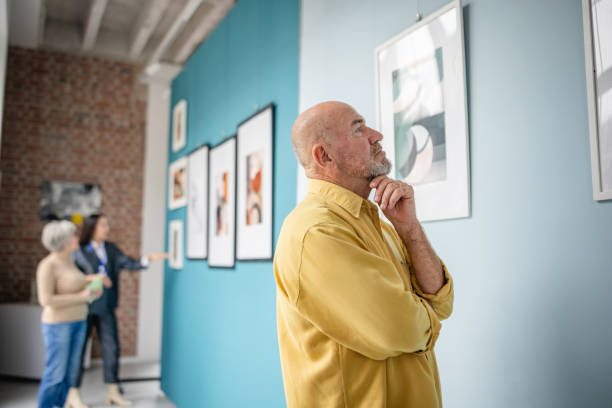 istock Visitors exploring and enjoying exhibits in an art gallery setting 2190533471