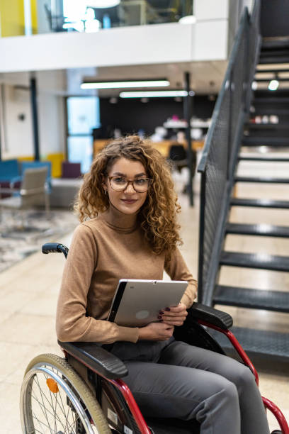istock Woman sits in a wheelchair 2190534886