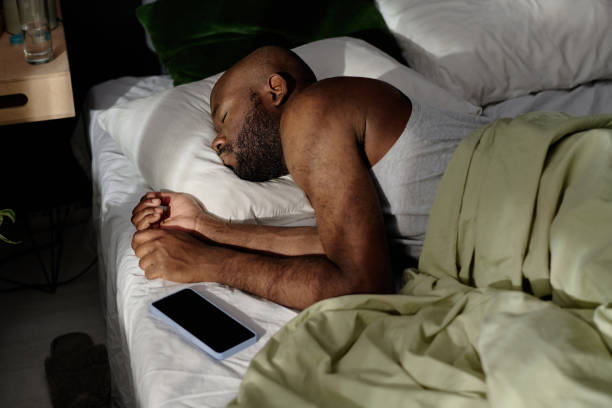 istock African American Man Sleeping Illumed with Sunrays 2190535390