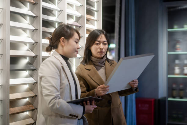 istock Asian female salespersons are communicating with clients while holding digital tablets. 2190537299