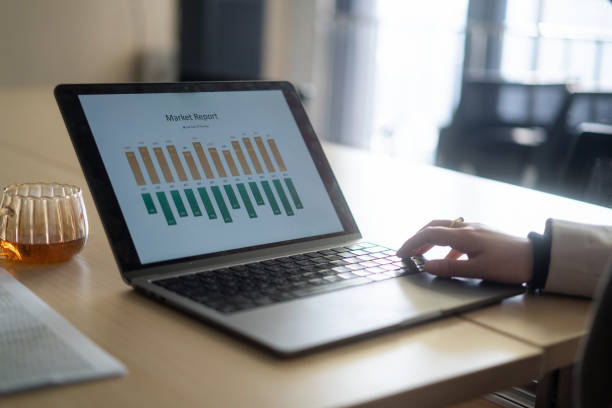 istock Financial statements on laptop 2190539135