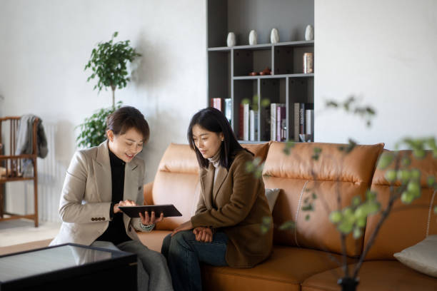 istock two asian businesswoman using digital tablet 2190543088