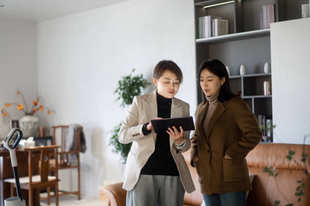 istock two asian businesswoman using digital tablet 2190543094