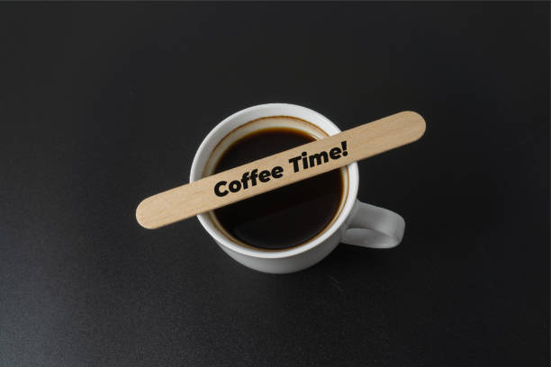 A cup of coffee with a word Coffee Time on black background