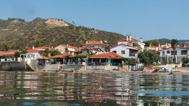 istock Coastal village under a vast sky 2190547037
