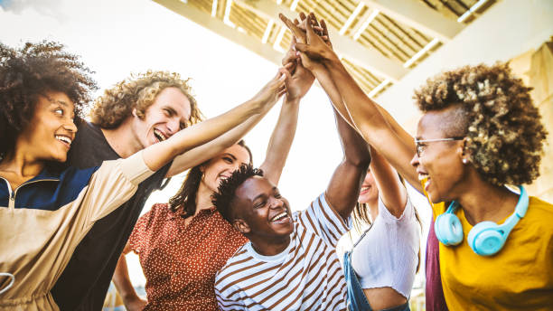 istock Community of young people stacking hands together - Multiracial college students putting their hands on top of each other - Human relationship, social, community and college concept 2190548319