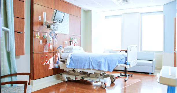 istock Private Room In Modern Hospital With Empty Bed And Medical Tech Equipment 2190549521