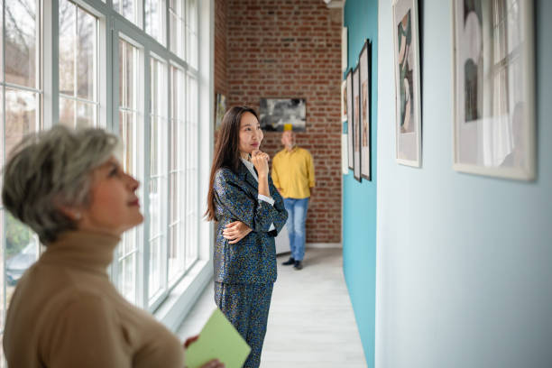 istock People Observing Artworks in a Contemporary Gallery Setting 2190550236