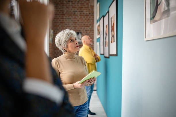 istock Art gallery visitors observing displayed artwork with interest and contemplation 2190551076