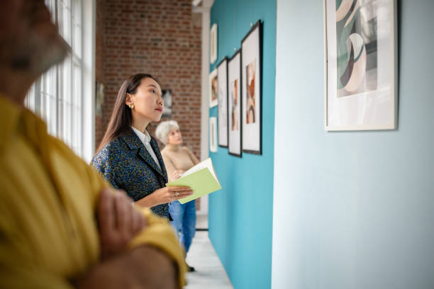 istock Visitors appreciating artworks in an art gallery 2190551425