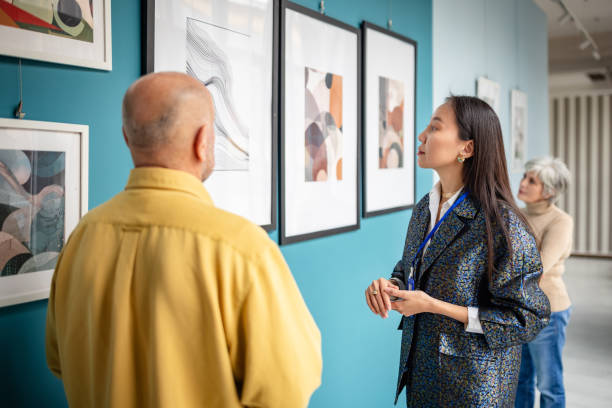 istock Visitors observing contemporary artwork in an art gallery exhibition setting 2190551989