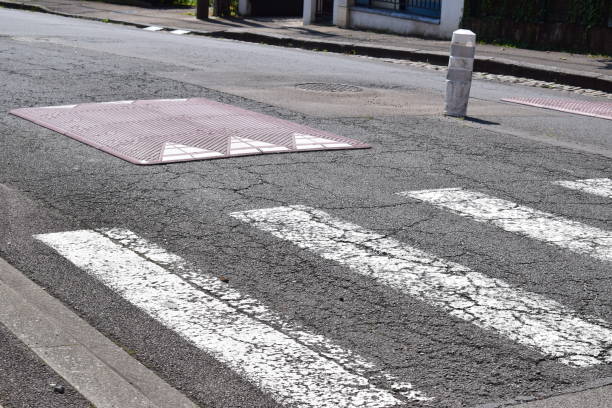 istock speed bump and pedestrian crossing 2190552583