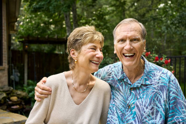 A Happy old elderly caucasian couple in a park