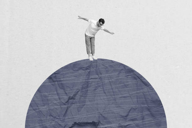 istock Creative collage picture illustration black white effect young miniature man keep balance unknown gigantic stone exclusive white background 2190553753