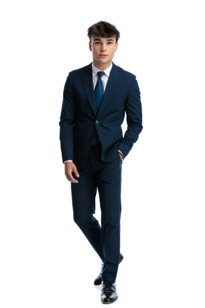 istock sexy young man in navy blue suit walking with hand in pocket 2190554332