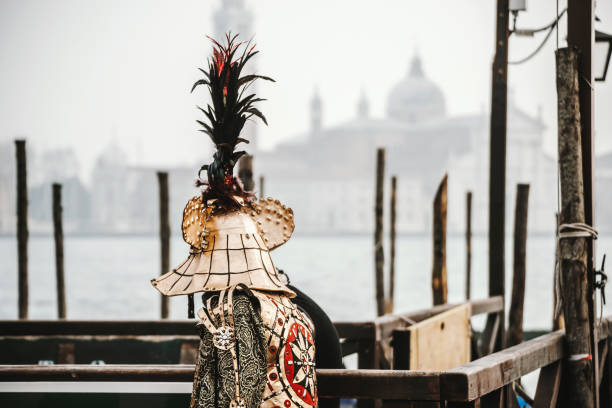 Venice, Veneto, Italy - February 11, 2024: Venice Carnival celebrations. Every year during the Carnival, thousands of people of all nationalities parade in magnificent and colorful costumes, reminiscent of Venice's glorious past, with characters brimming with creativity and imagination.